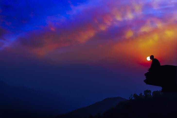 A seeker in quiet contemplation at dusk